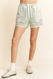 Sage shorts with floral patch detail